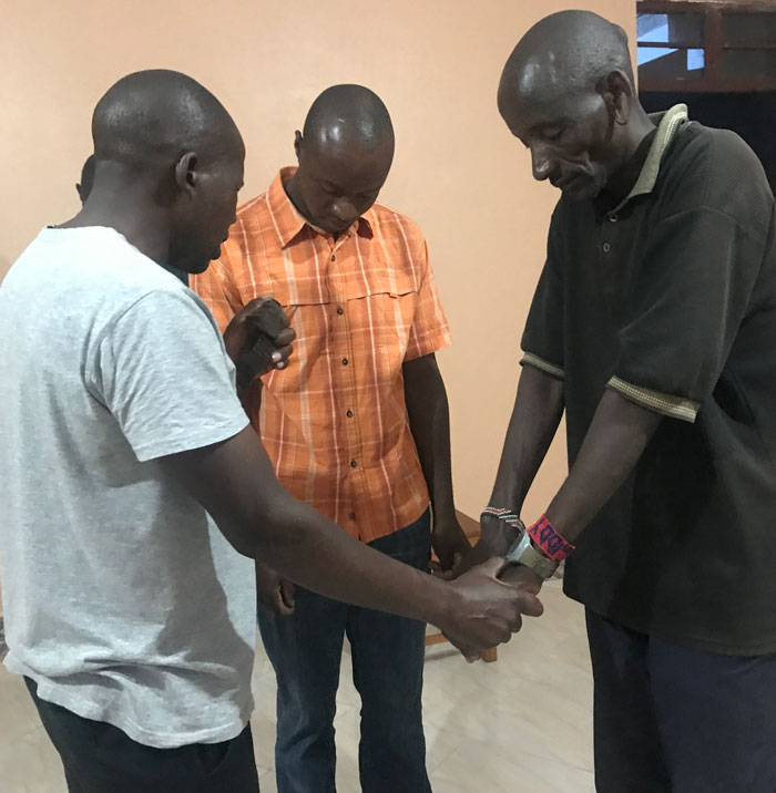 Workers are praying for the Sister2Sister International Outreach Ministry mission and construction